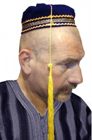Cappello fez arabo blu da mercante con lungo pennacchio giallo