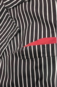 Tessuto gessato del costume da gangster dettaglio della giacca